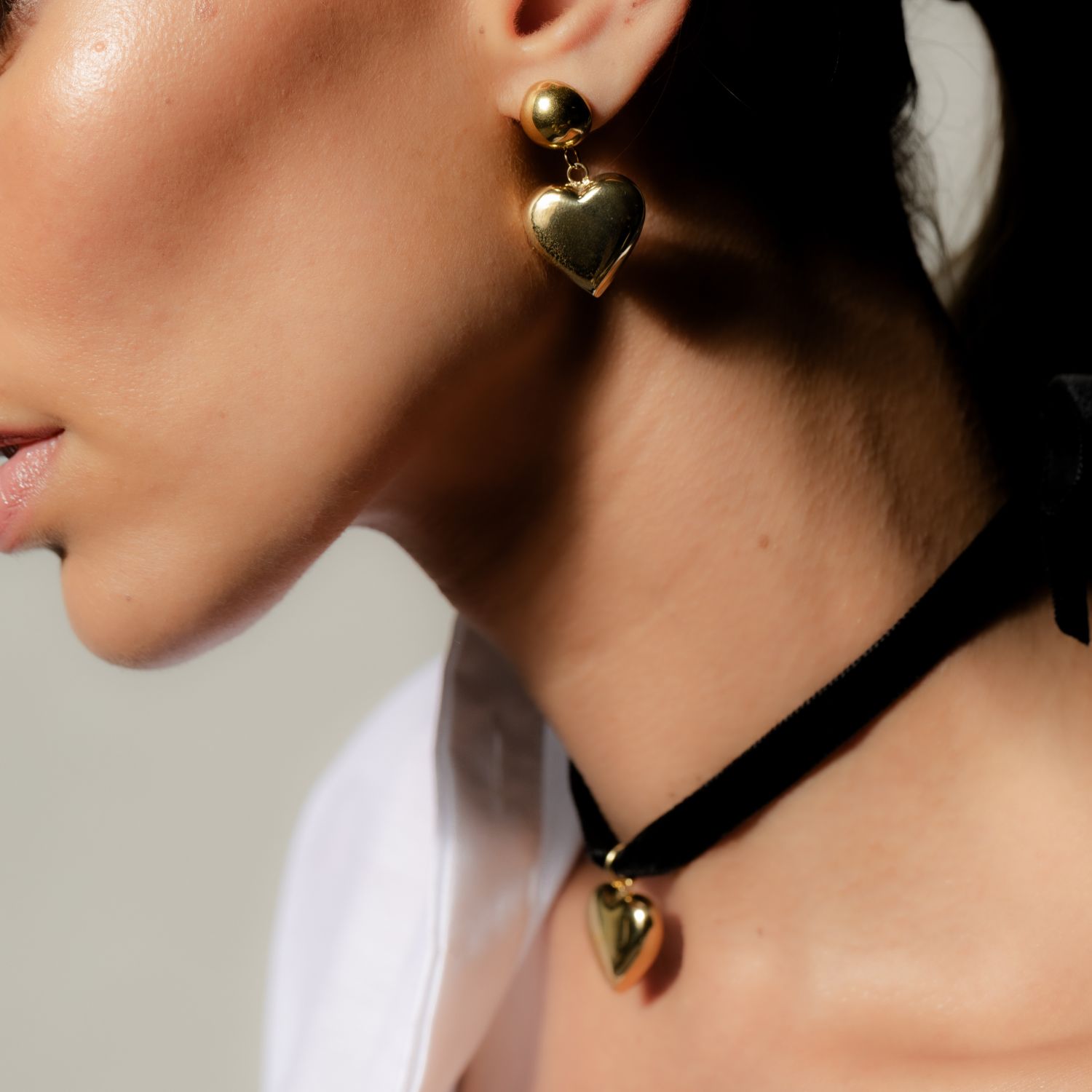 Silk & Steel Cupid drop earrings in 14k gold-plated stainless steel.