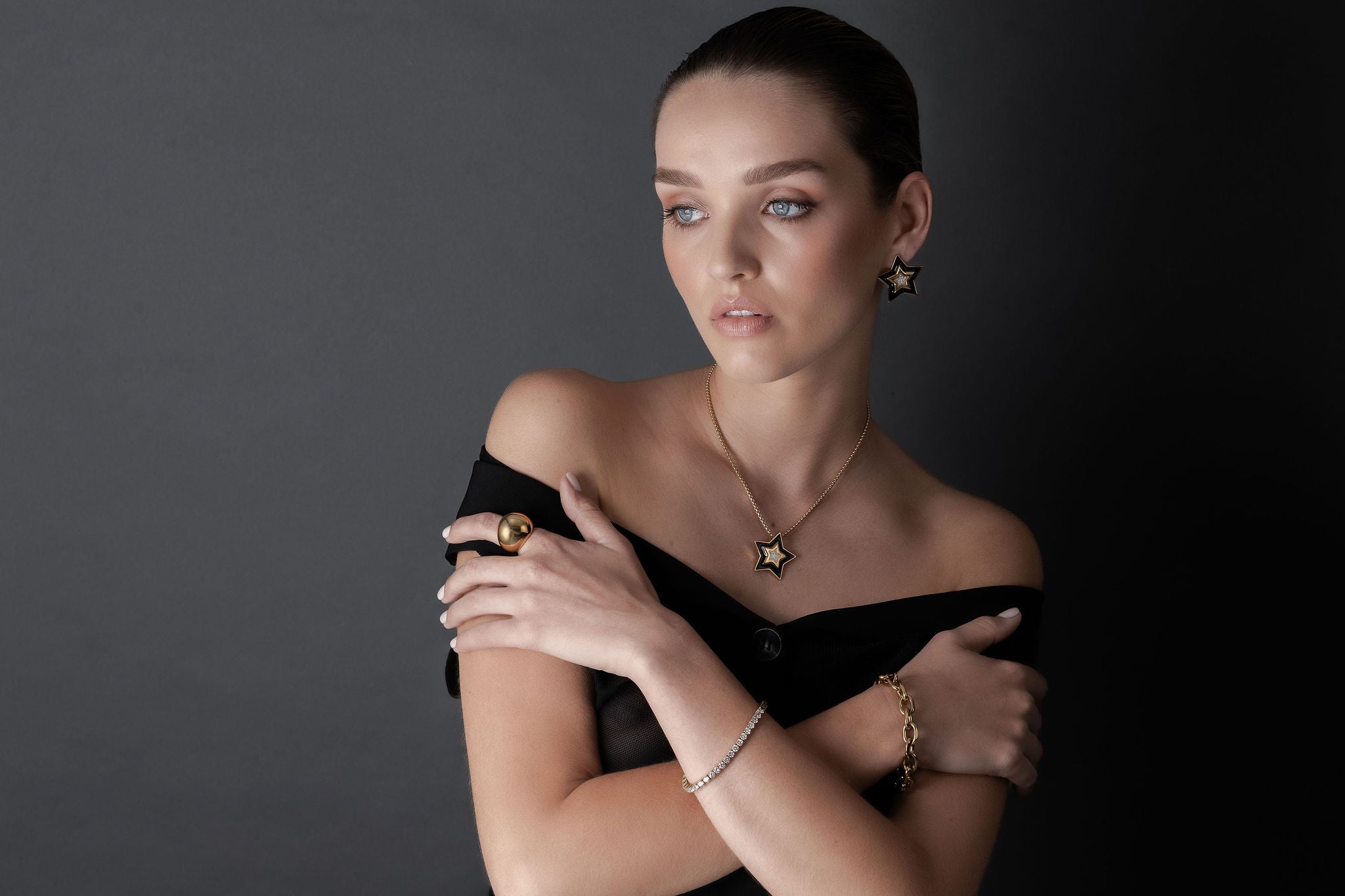 Silk & Steel Nova Necklace Jewellery Collection with model wearing large statement star earrings and necklace