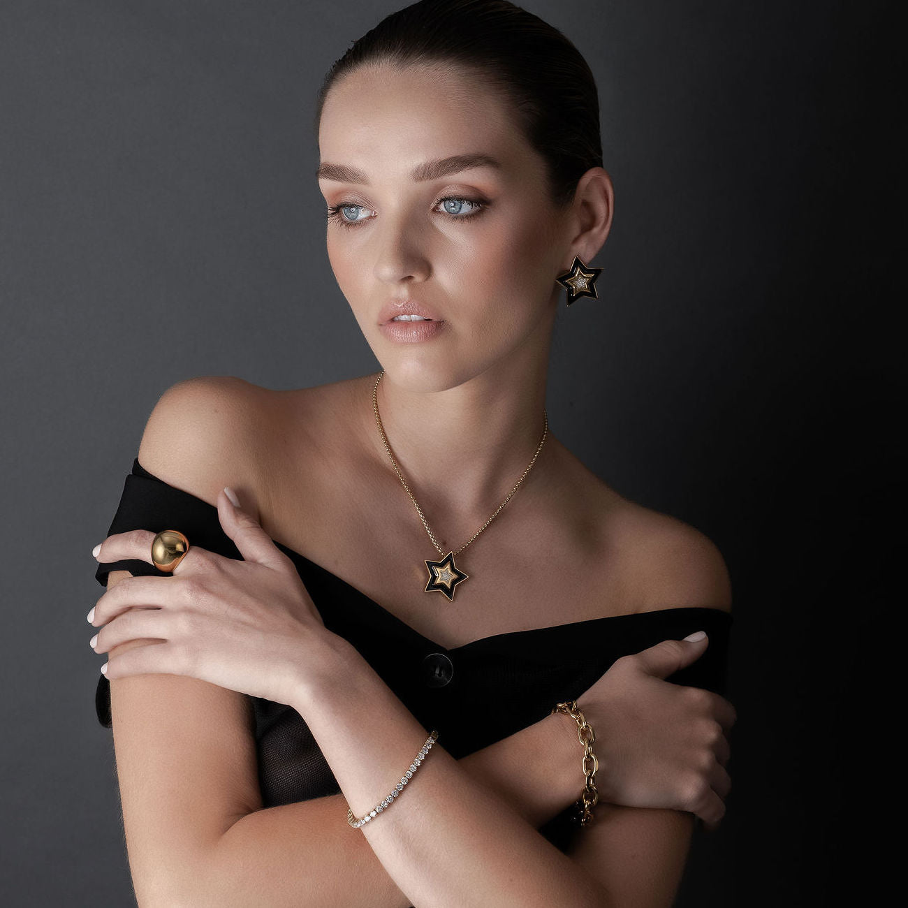 Supernova Star Pendant Necklace and Star Pendant Earrings in 14k gold-plated stainless steel with Black Enamel and Cubic Zirconias | Silk & Steel Jewellery