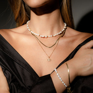 Silk & Steel Solara necklace in 14k gold-plated stainless steel.