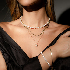 Silk & Steel Celine choker necklace with pearl in 14k gold-plated stainless steel.