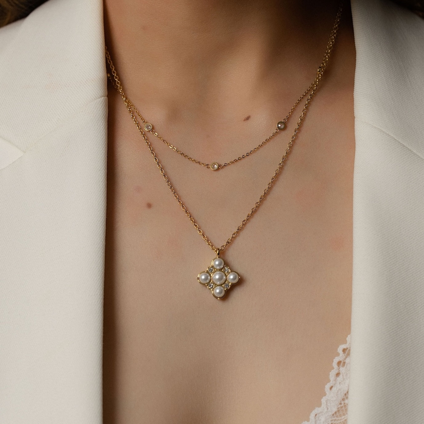 Silk & Steel Perla Necklace and Solstice Necklace in 14k gold-plated stainless steel with faux pearls and cubic zirconias.
