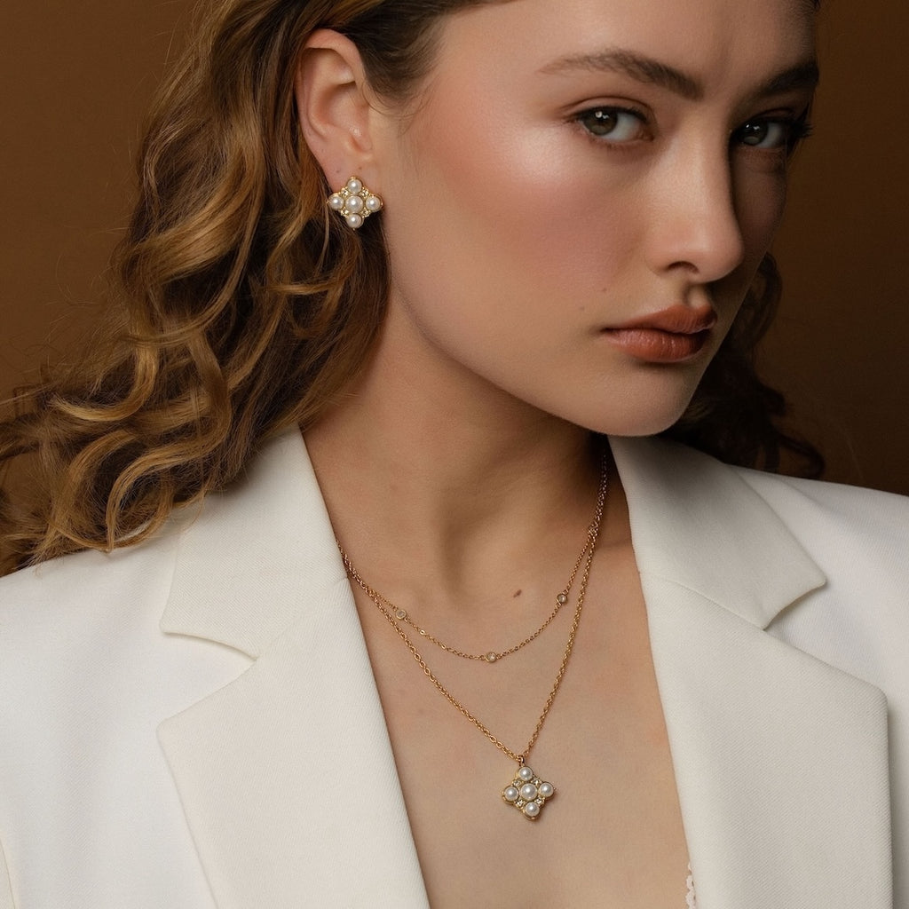 Silk & Steel Perla studs and necklace in 14k gold-plated stainless steel with CZs and faux pearls.