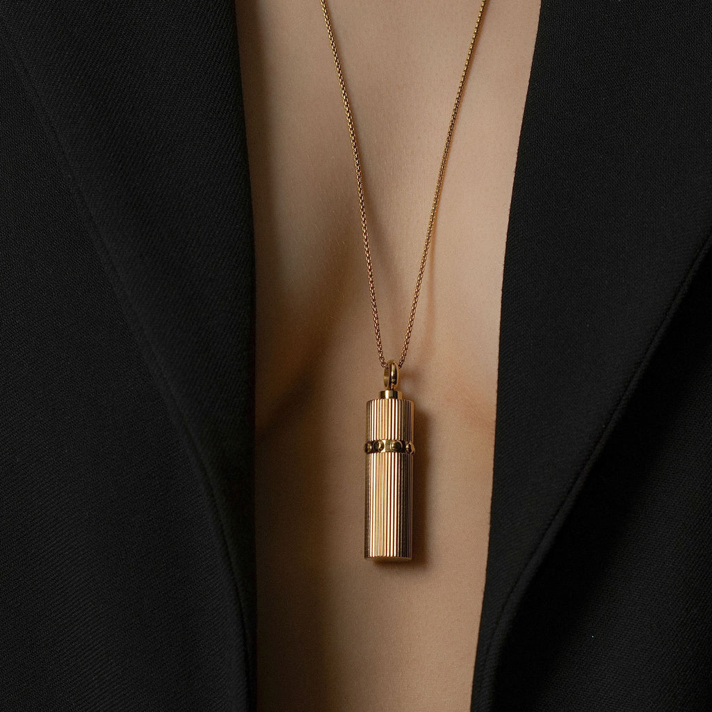 Model wears Silk & Steel Odyssée Capsule Necklace in 14k gold-plated stainless steel.