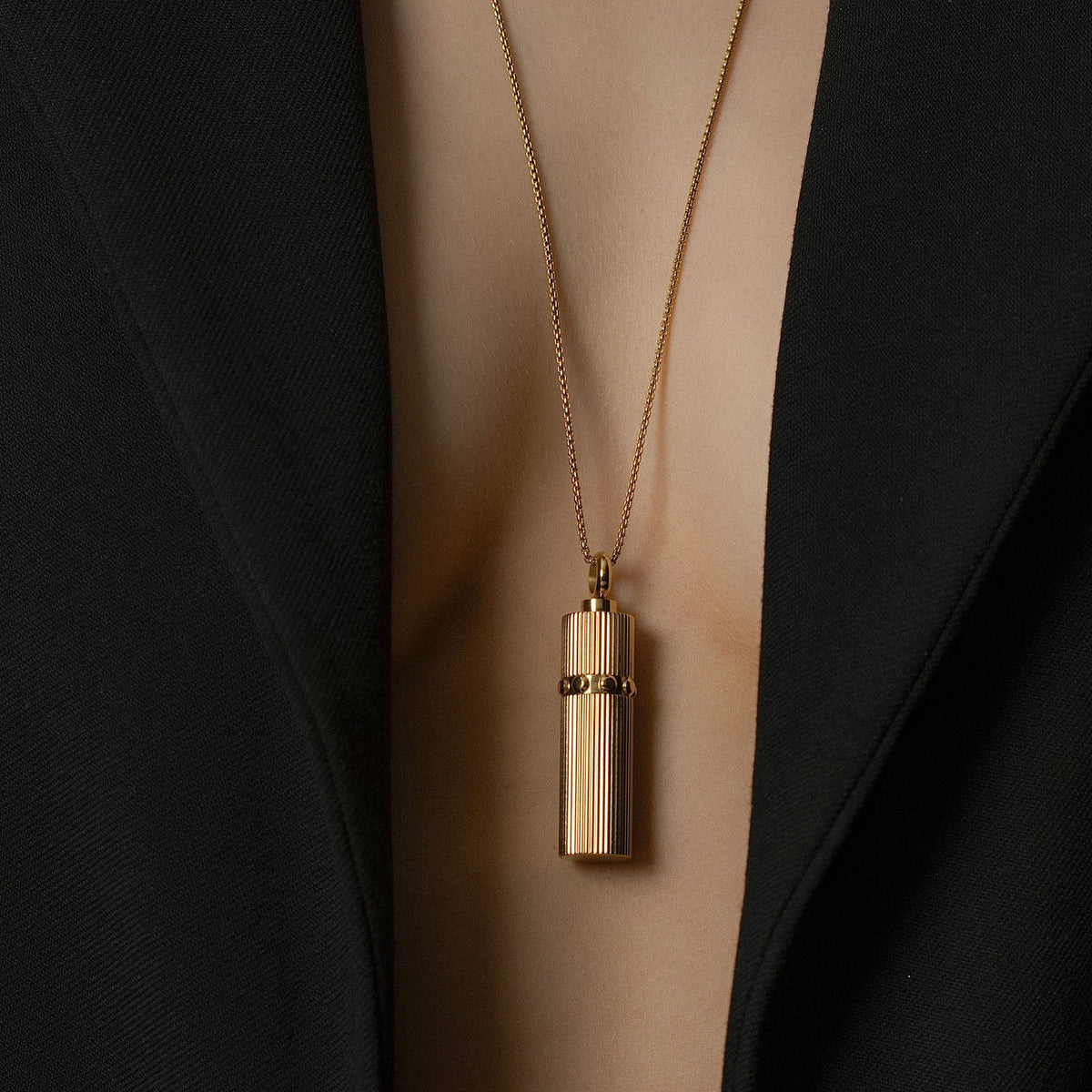 Model wears Silk & Steel Odyssée Capsule Necklace in 14k gold-plated stainless steel.