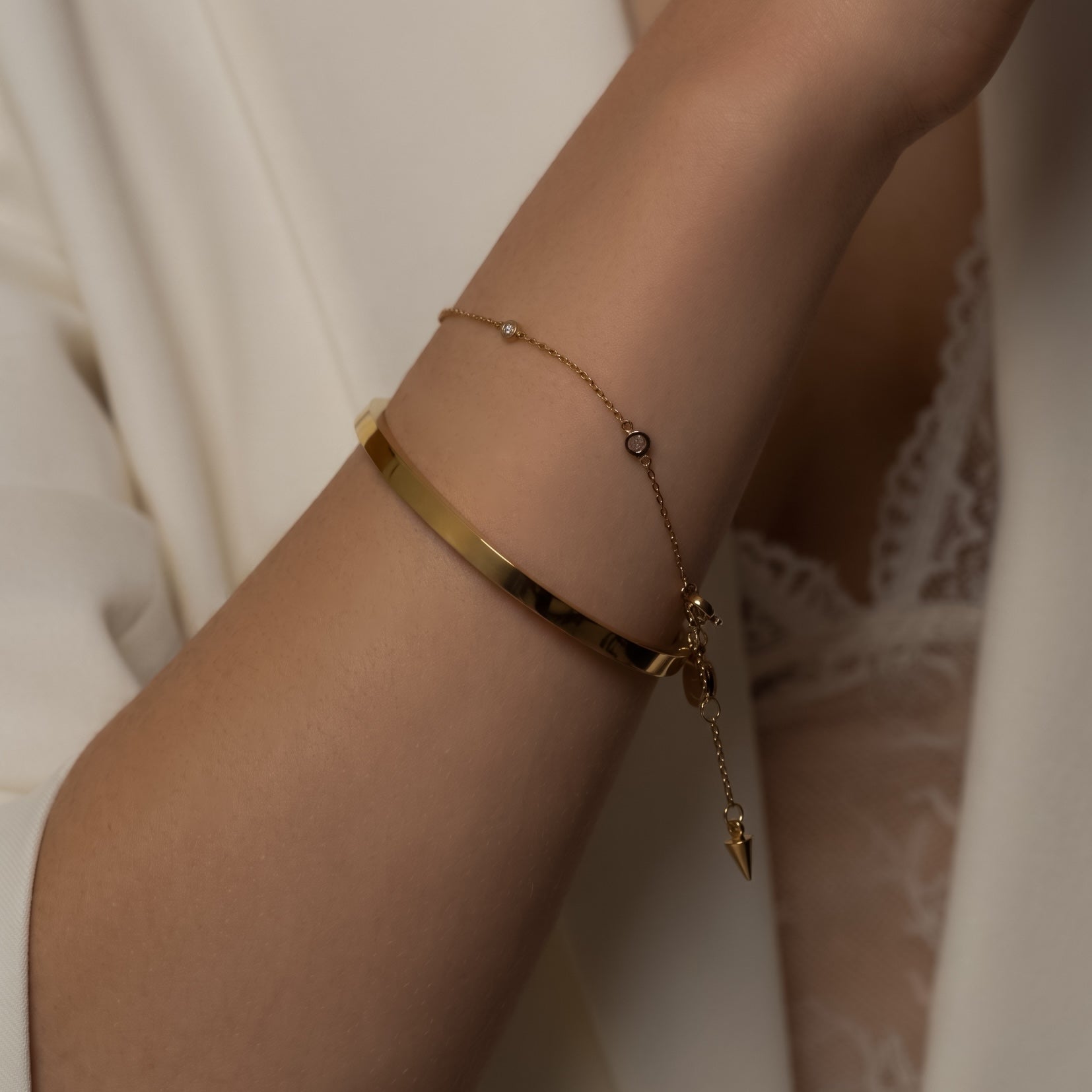 Silk & Steel Thin Voyage Bangle and Solstice Bracelet in 14k gold-plated stainless steel with cubic zirconias.