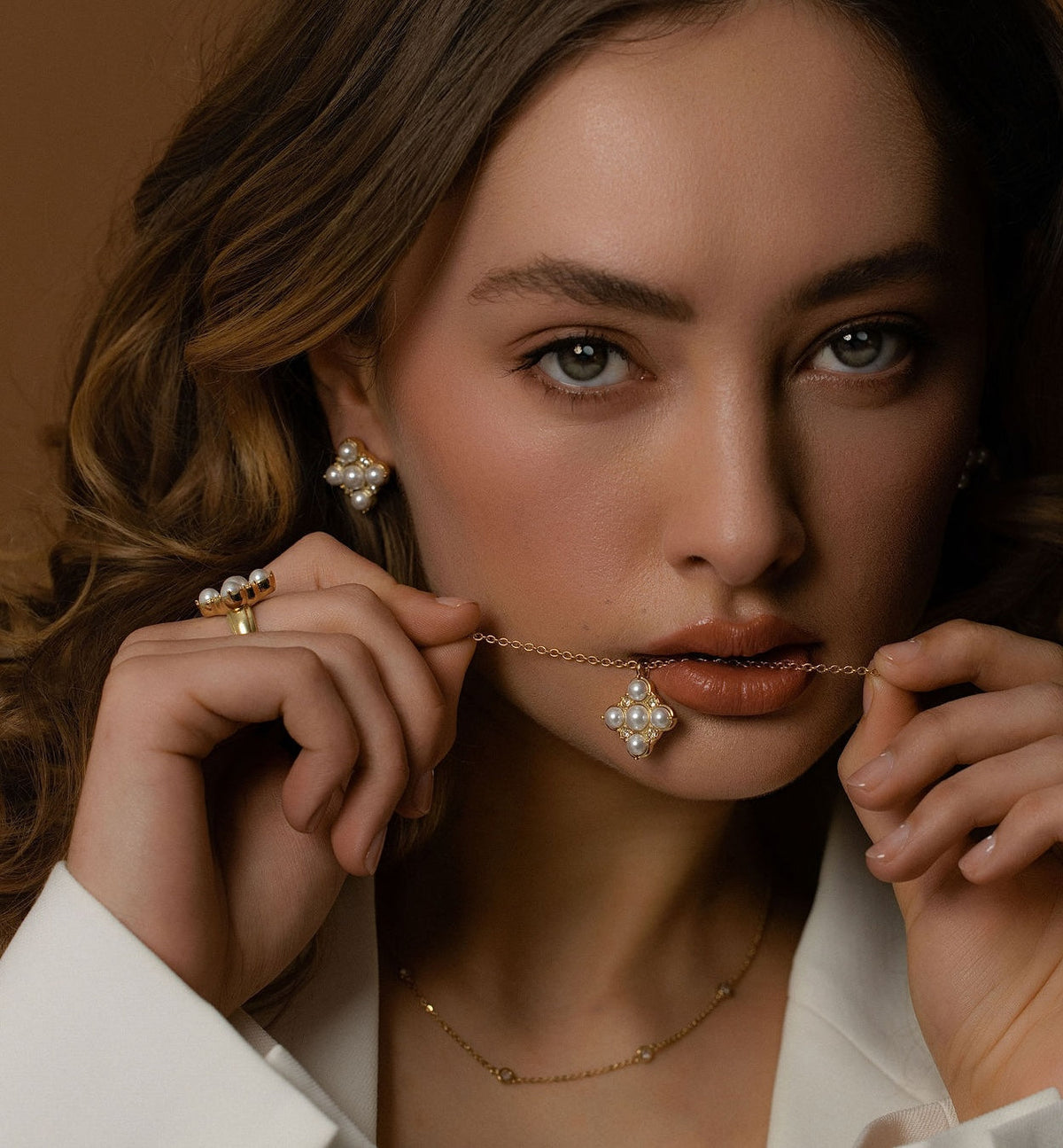 Silk & Steel Perla necklace in 14k gold-plated stainless steel with CZs and faux pearls. 