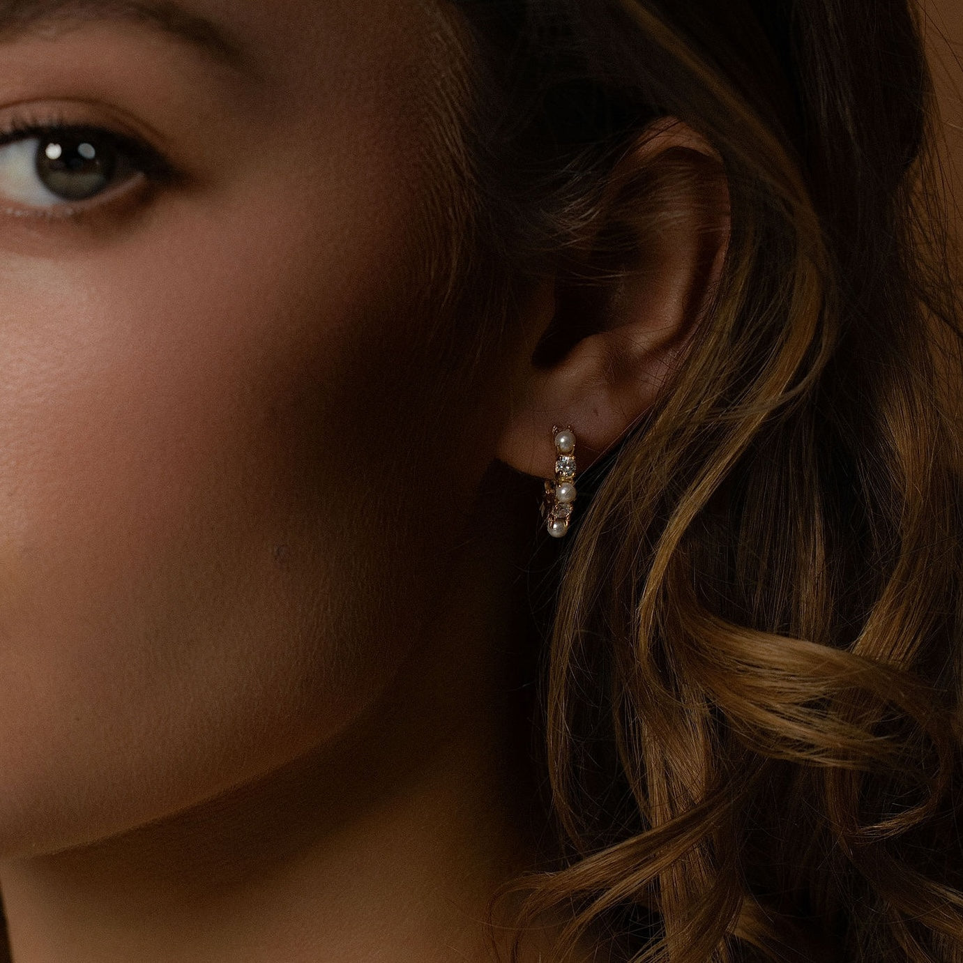 Silk & Steel Perla hoops in 14k gold-plated stainless steel with CZs and faux pearls.