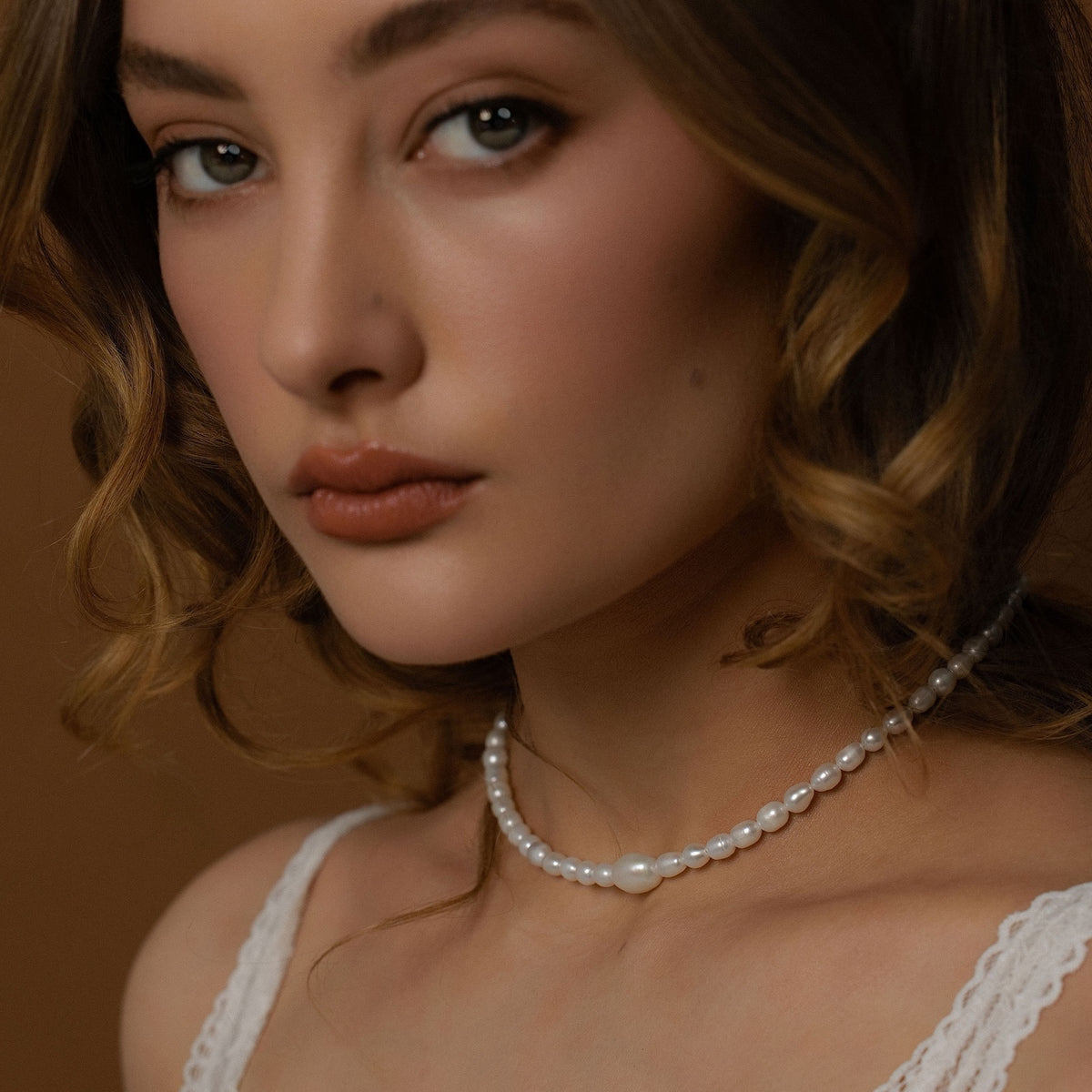 Silk & Steel Pearl Necklace in 14k gold-plated stainless steel with freshwater pearls.