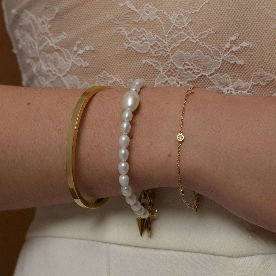 Silk & Steel Thin Voyage Bangle, Pearl Bracelet and Solstice Bracelet in 14k gold-plated stainless steel with cubic zirconias and freshwater pearls.