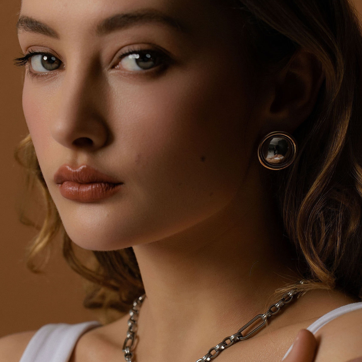 Silk & Steel Two Tone Globe Earrings in 14k gold-plated and high polish silver stainless steel.