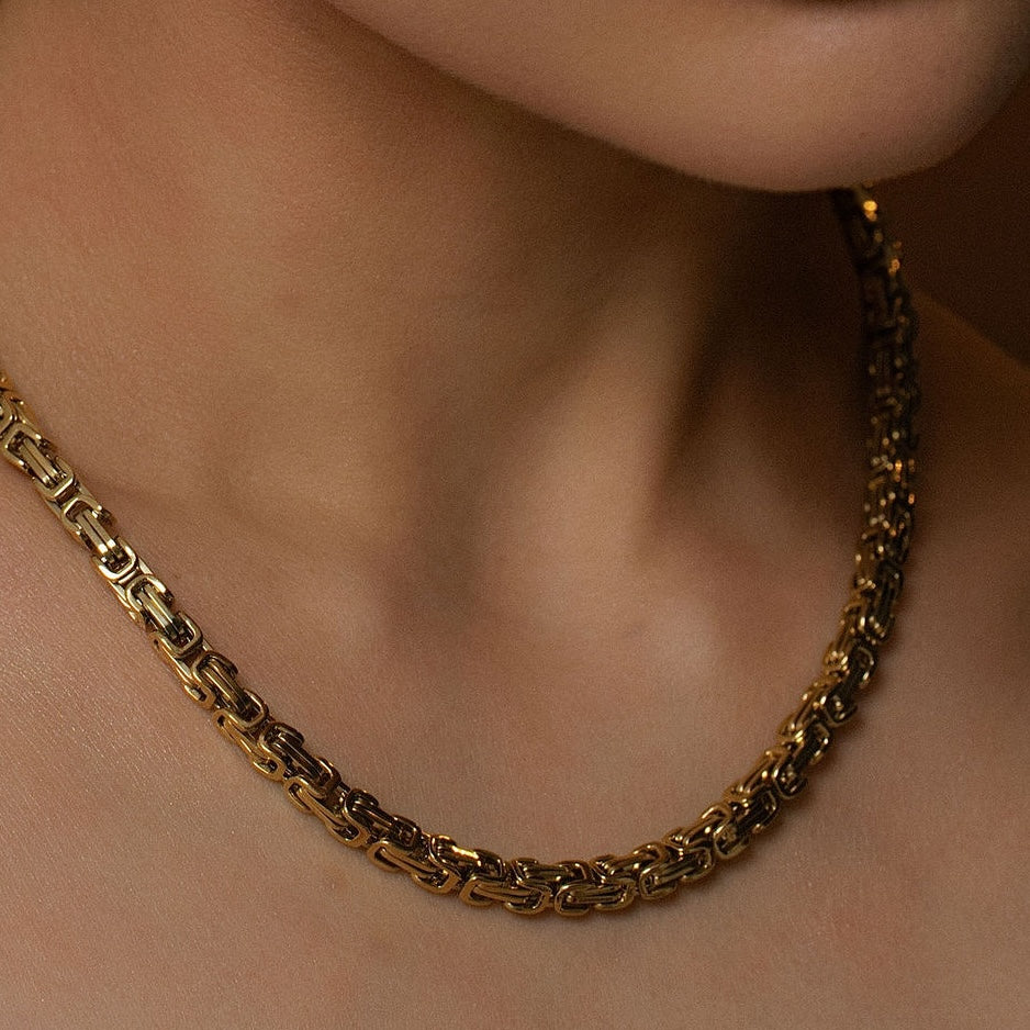 Model wearing Silk & Steel Meridian Necklace in 14k gold-plated stainless steel.