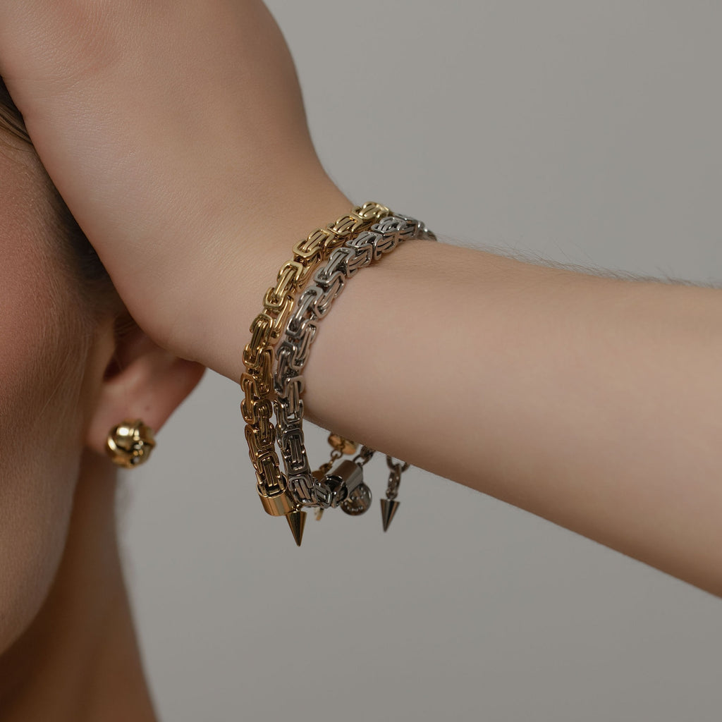 Model wearing Silk & Steel Meridian Bracelet in silver and 14k gold-plated stainless steel.