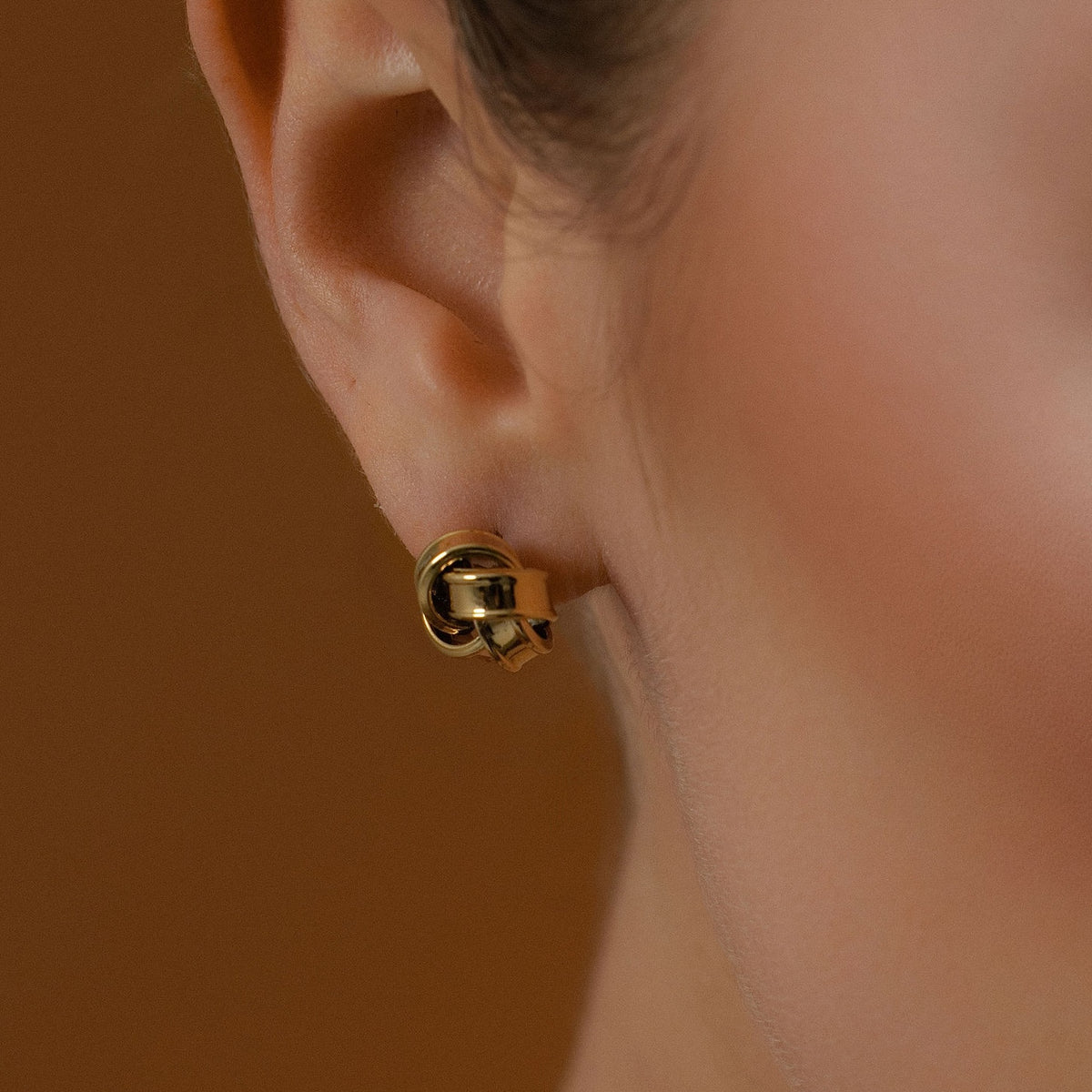 Silk & Steel Knot Studs with vintage woven design in 14k gold-plated stainless steel.