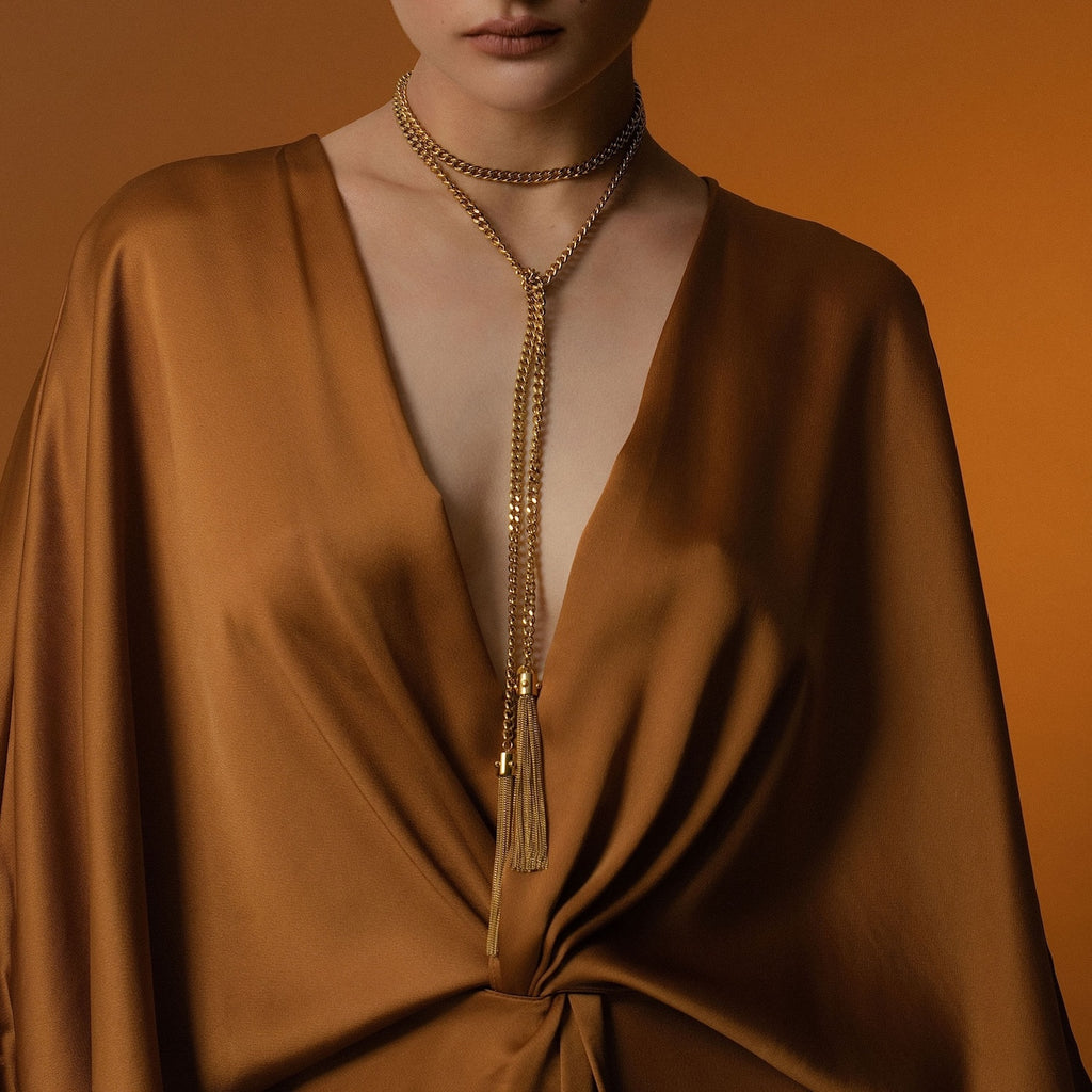 Model wears Silk & Steel Odyssée Tassel Lariat in 14k gold-plated stainless steel.