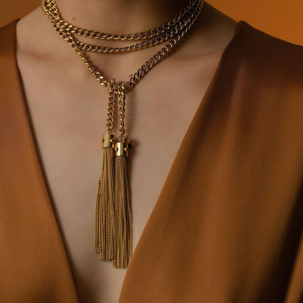 Model wears Silk & Steel Odyssée Tassel Lariat in 14k gold-plated stainless steel.