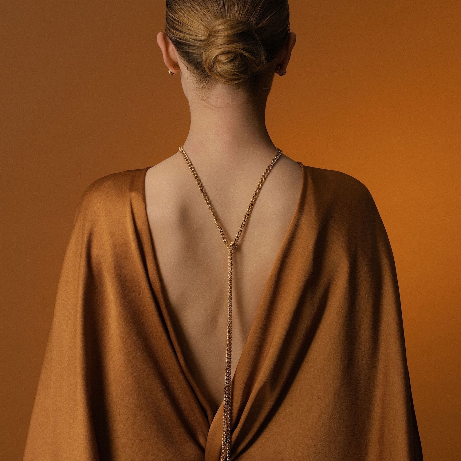 Model wears Silk & Steel Odyssée Tassel Lariat in 14k gold-plated stainless steel.