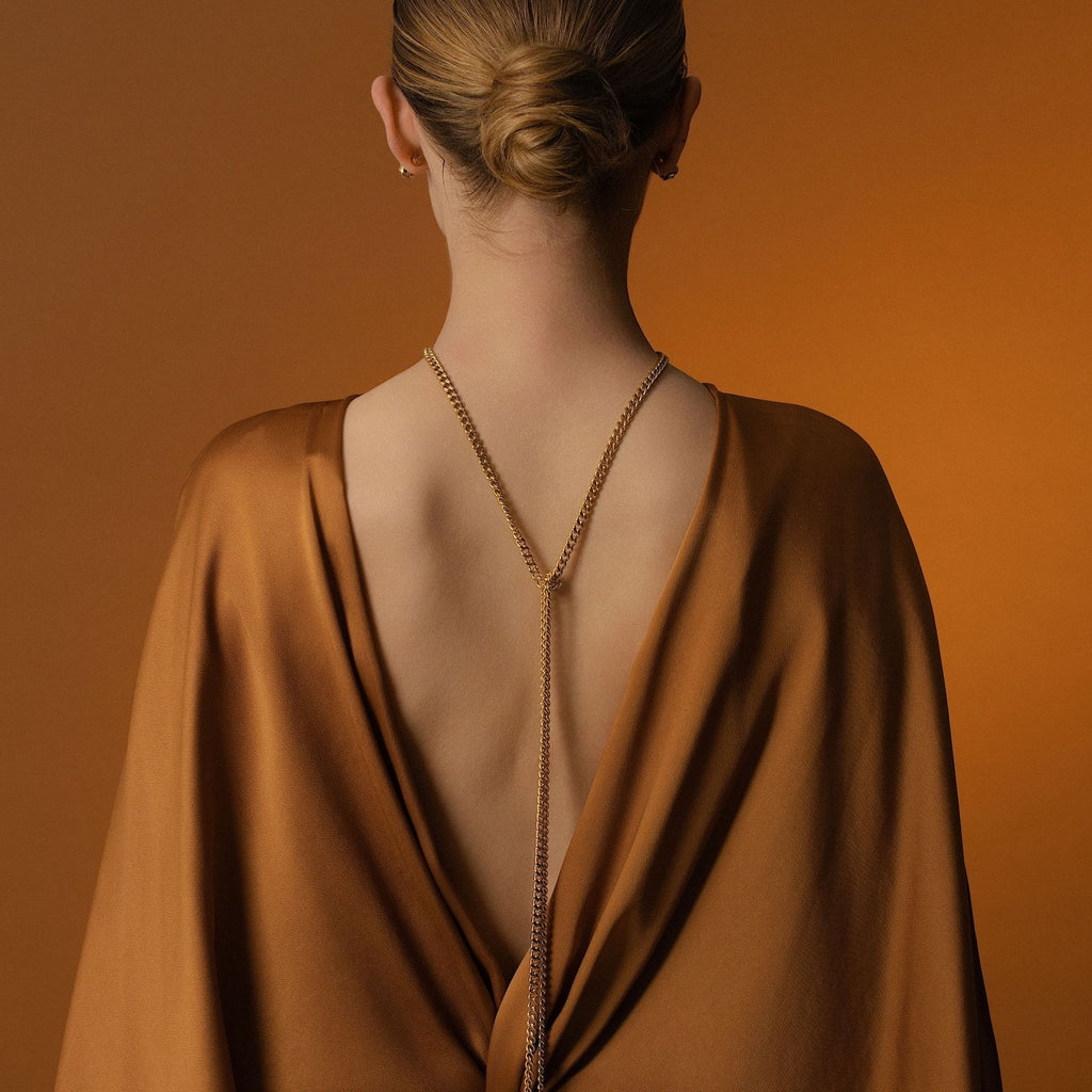 Model wears Silk & Steel Odyssée Tassel Lariat in 14k gold-plated stainless steel.