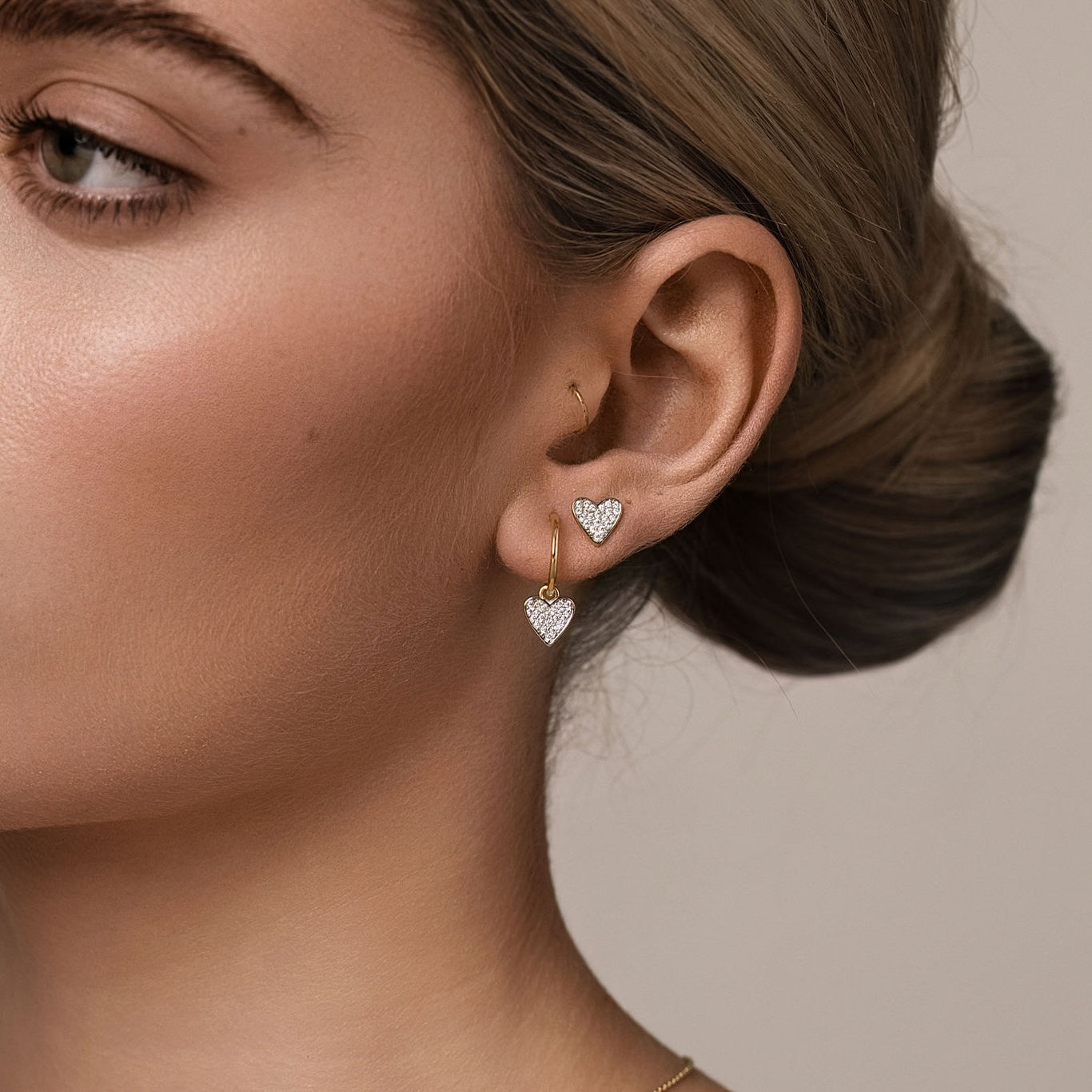 Silk & Steel Storyteller Love Hoop Earrings and Studs in 14k gold-plated sterling silver with cubic zirconia.