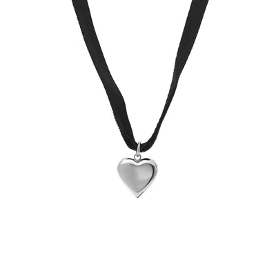 Silk & Steel cupid choker necklace in black velvet ribbon and puffed heart pendant in silver stainless steel.