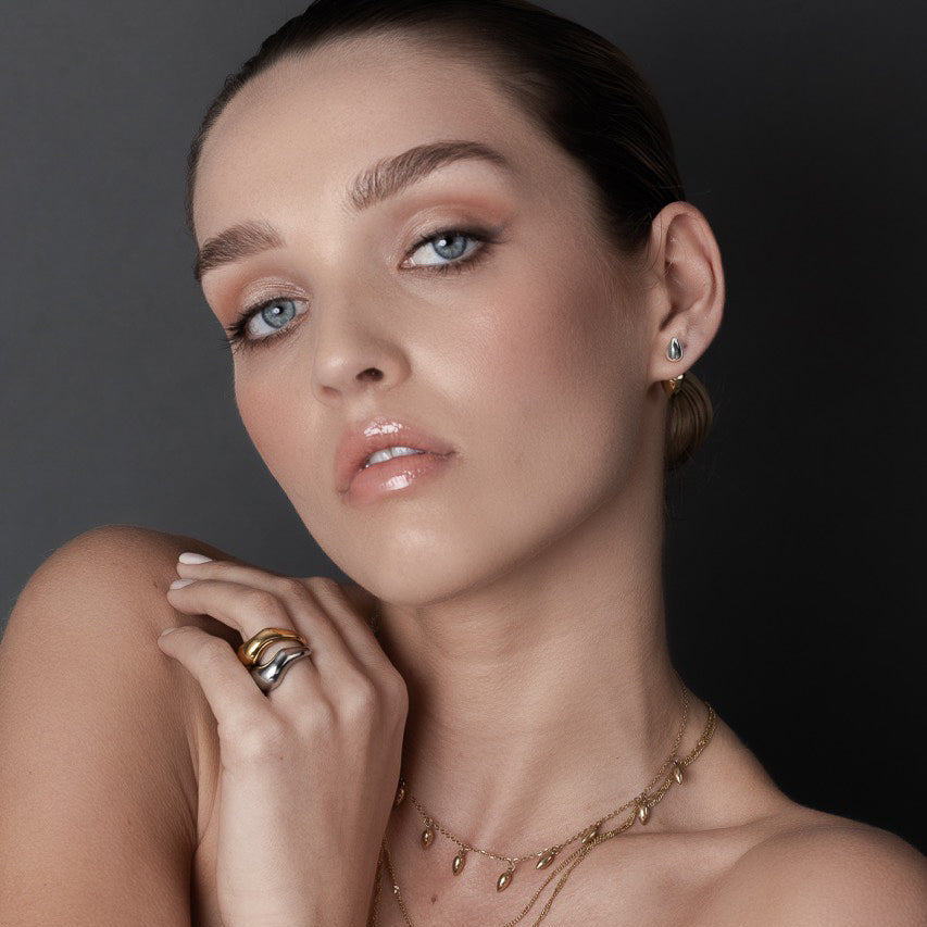 Sculptural two-tone double spike ear jacket earrings in 14k gold-plated and silver stainless steel
