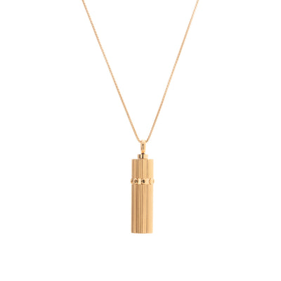 Silk & Steel Capsule Necklace featuring a 14k gold-plated stainless steel keepsake capsule pendant.