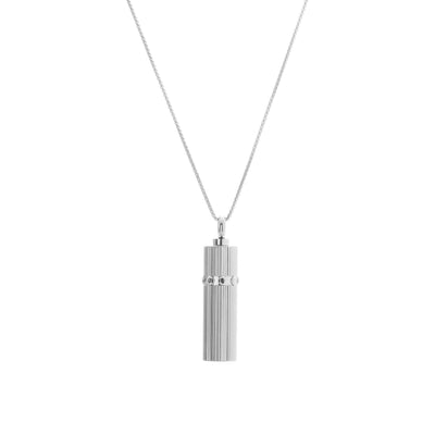 Silk & Steel Capsule Necklace featuring a high-polish stainless steel keepsake capsule pendant.