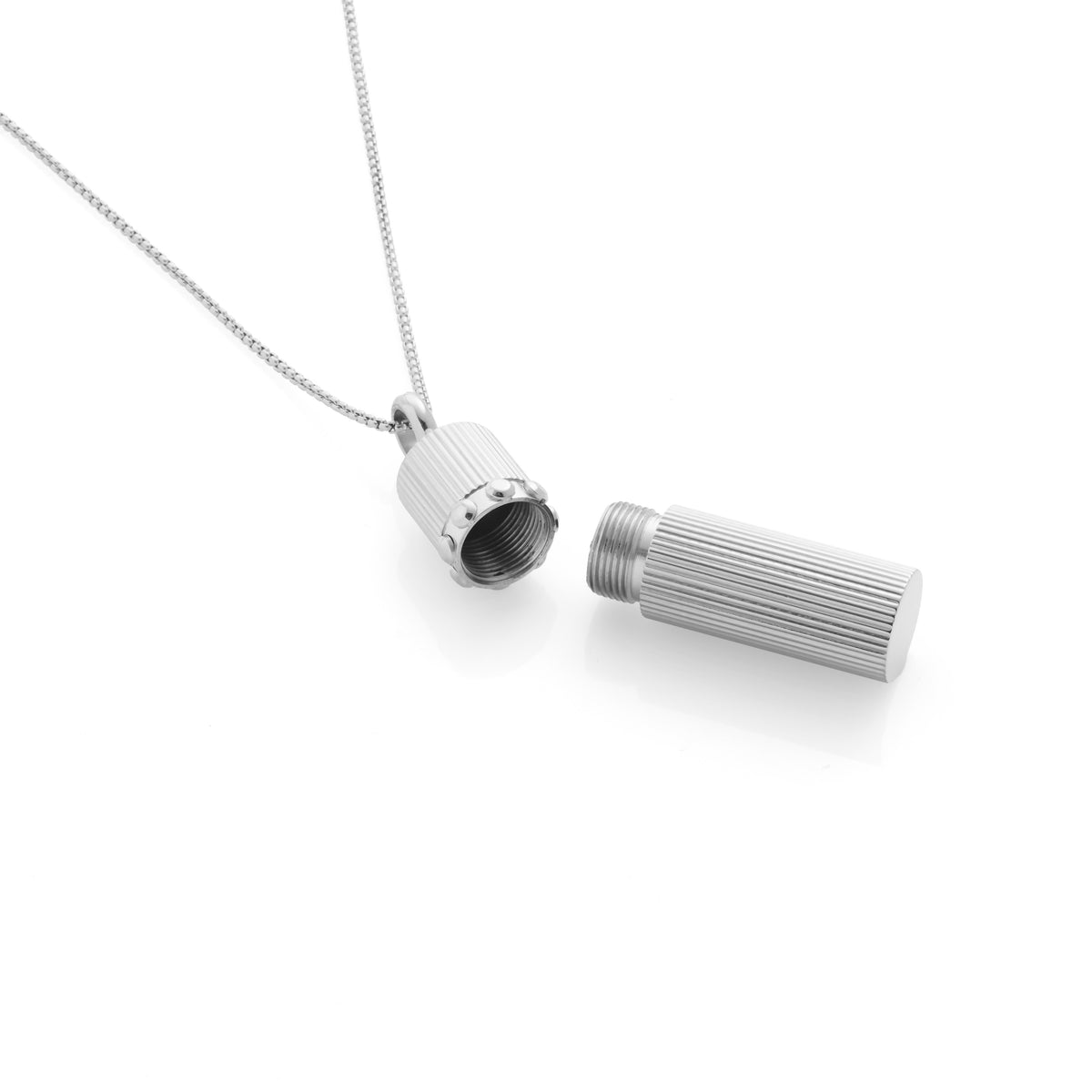 Silk & Steel Capsule Necklace featuring a high-polish stainless steel keepsake capsule pendant.