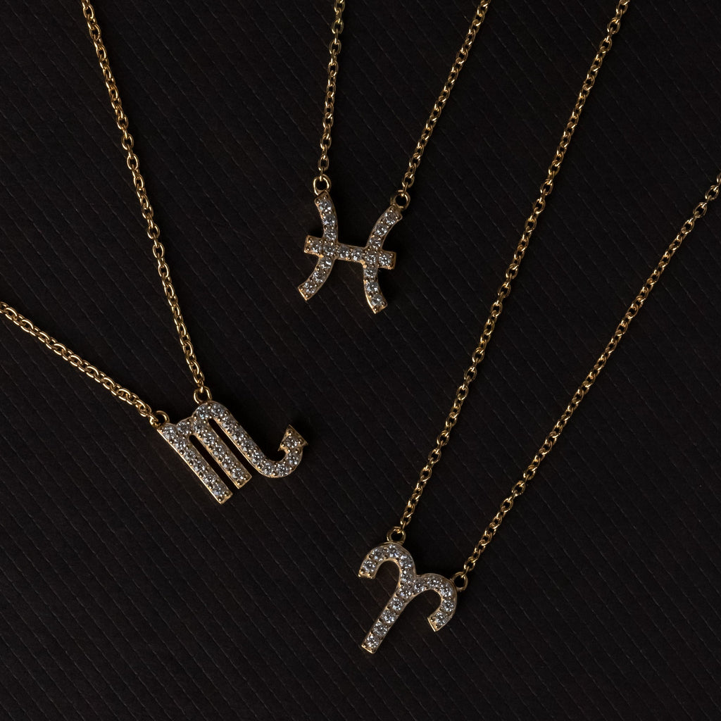 Zodiac star sign necklaces by Silk & Steel Jewellery in sterling silver and 14k gold-plated sterling silver.