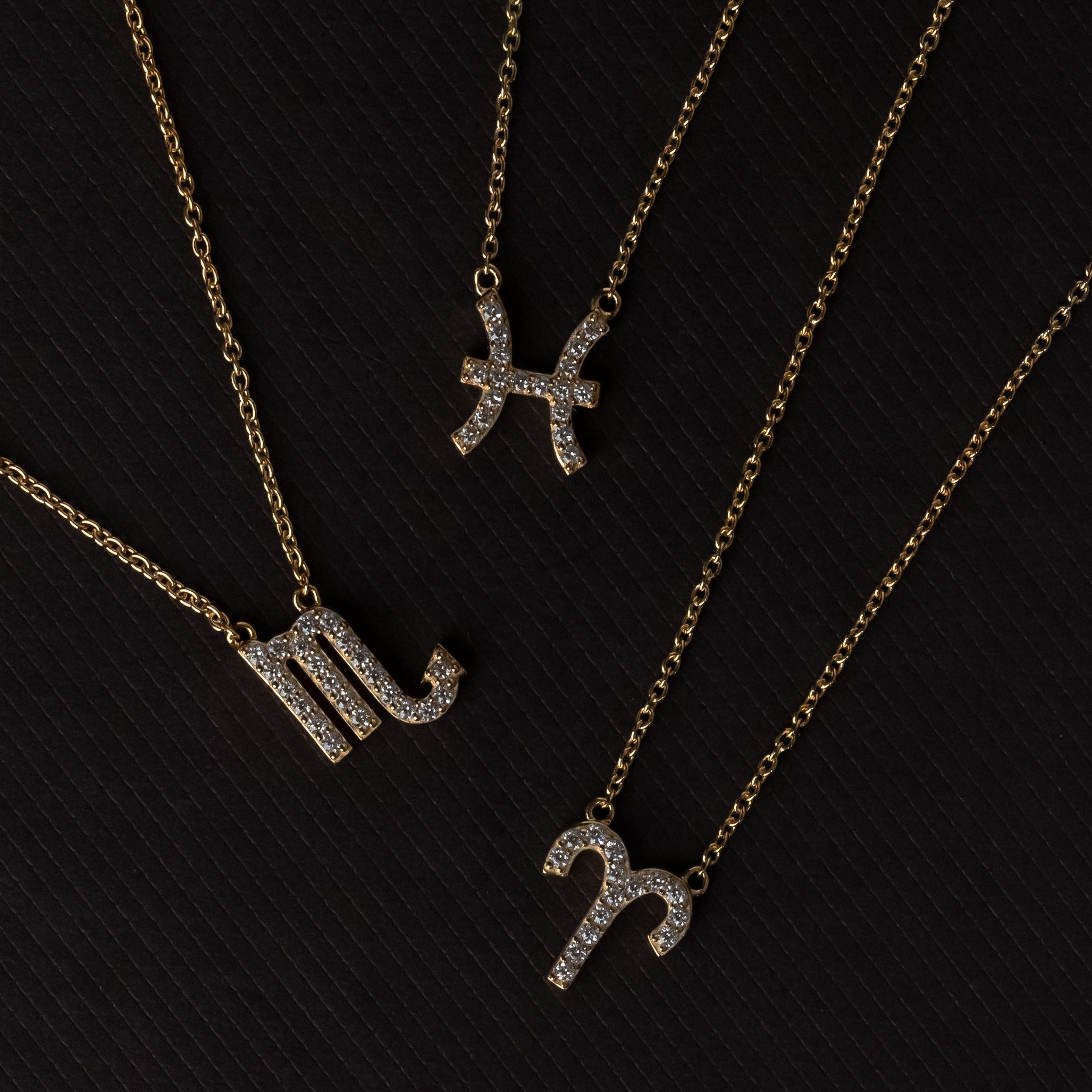 Zodiac star sign necklaces by Silk & Steel Jewellery in sterling silver and 14k gold-plated sterling silver.
